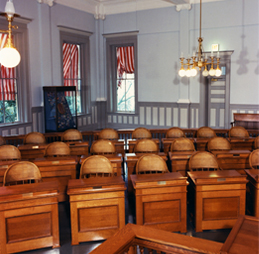 Rows of reproduction legislative desks in the Old Florida Capitol