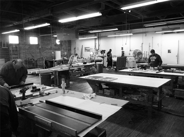 Craftspeople working in Akira's Gainesville shop