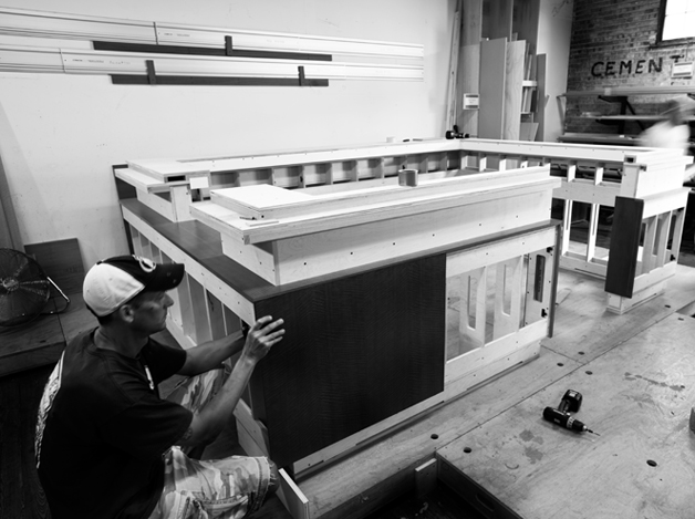 Craftsperson assembling architectural millwork